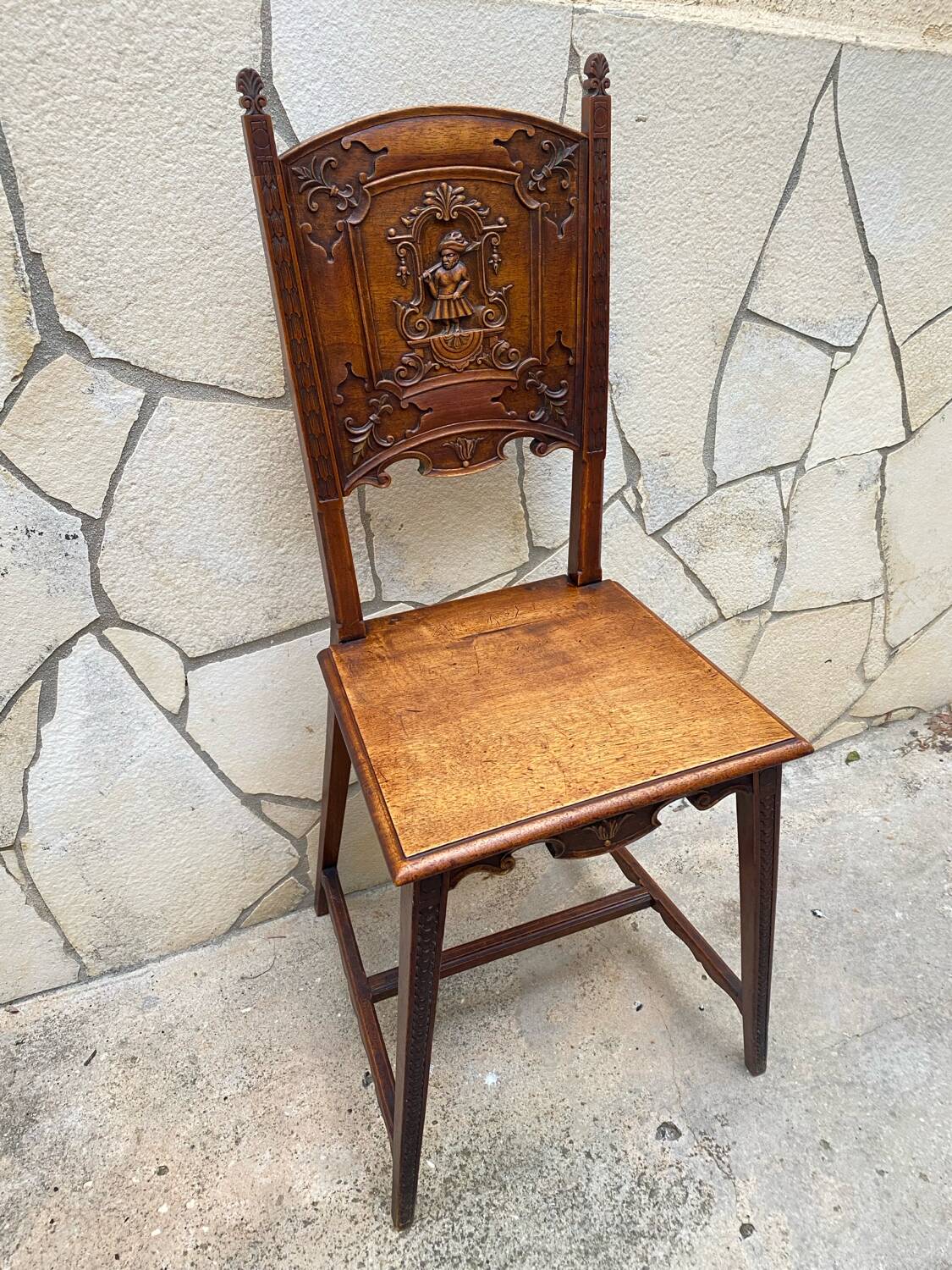 Carved walnut lounge chair