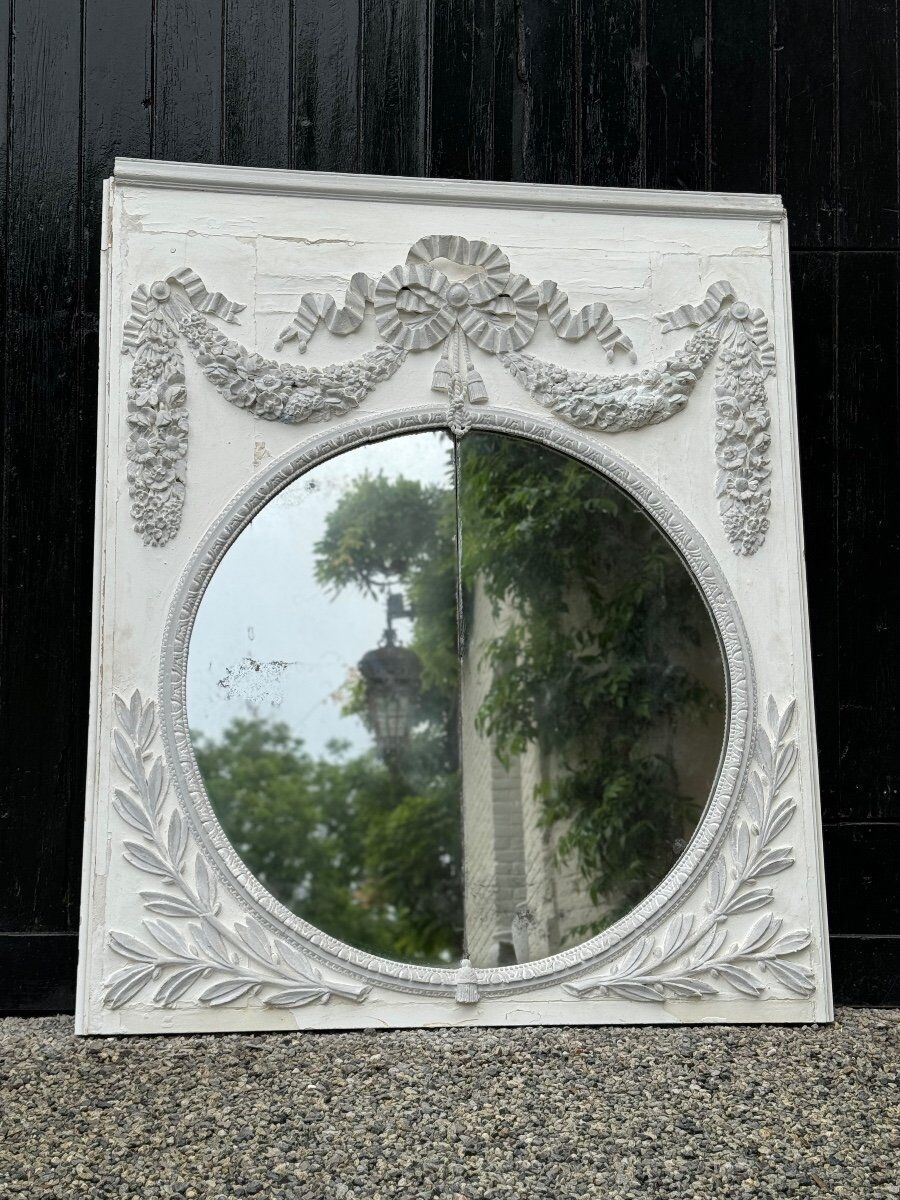 Louis XVI style fireplace mirror, carved wood trumeau with white and grey highlights, 18th century