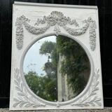 Louis XVI style fireplace mirror, carved wood trumeau with white and grey highlights, 18th century