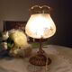 Bronze foot table lamp, satin amber lampshade, circa 1960