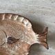 Decorative ceramic plate in the shape of a fish from the 1970s.