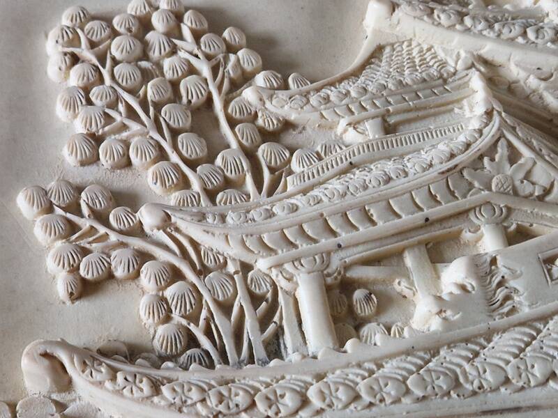 Sculpted resin plaque in the style of China.