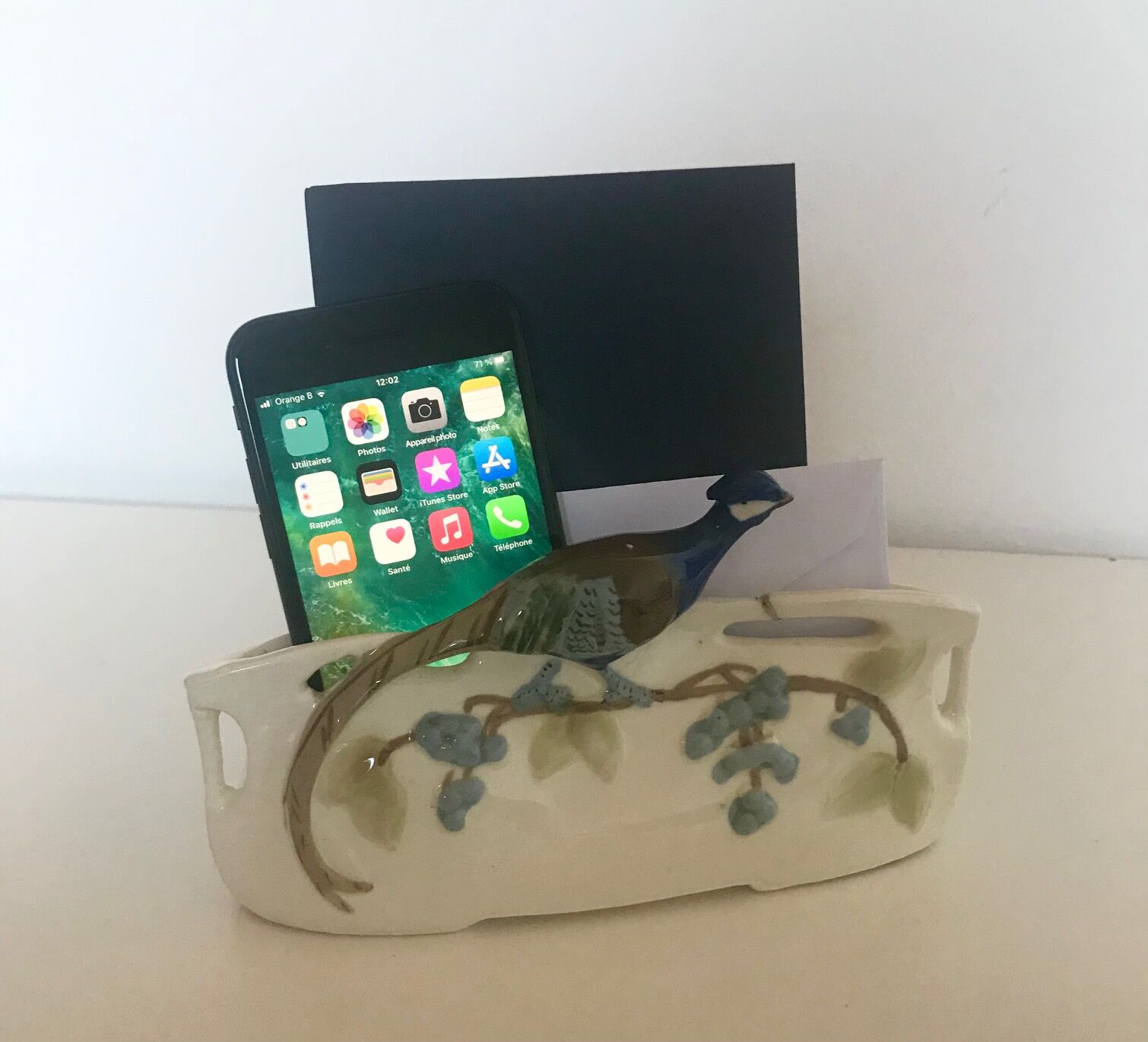 Letter door in earthenware topped with a peacock