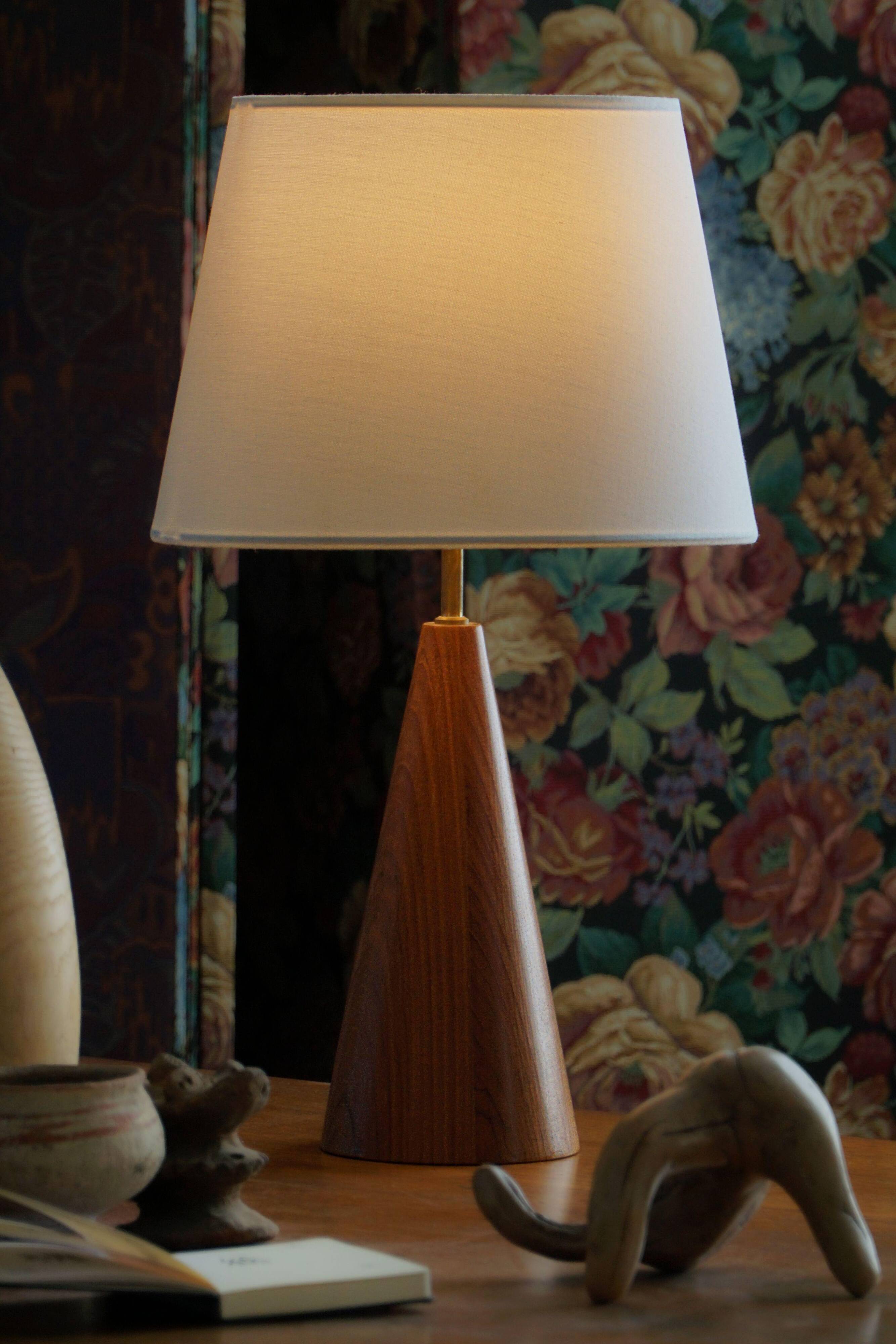 Modern Danish, a conical table lamp in teak, 1980s.