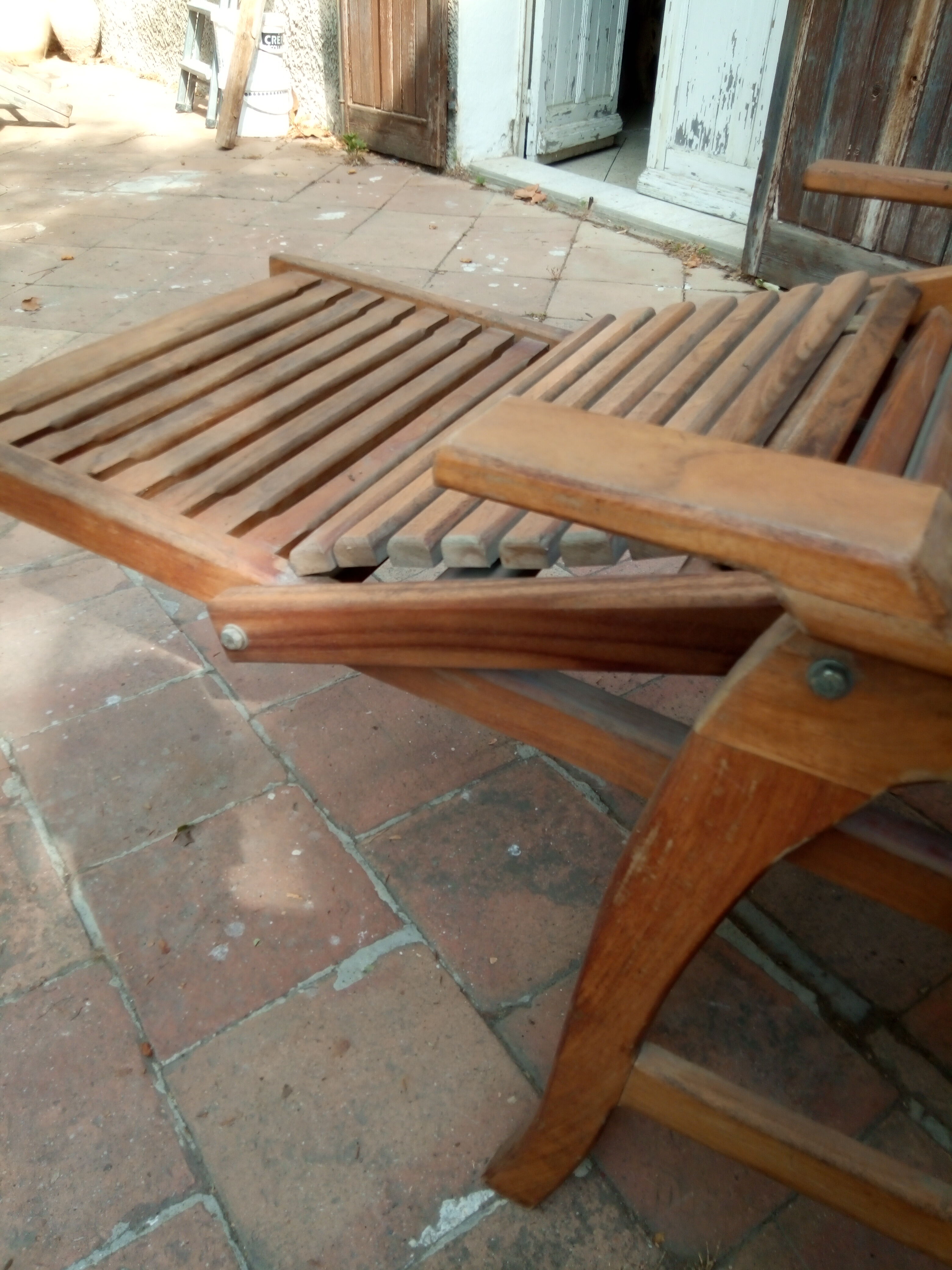 Teak stretchy long chair.