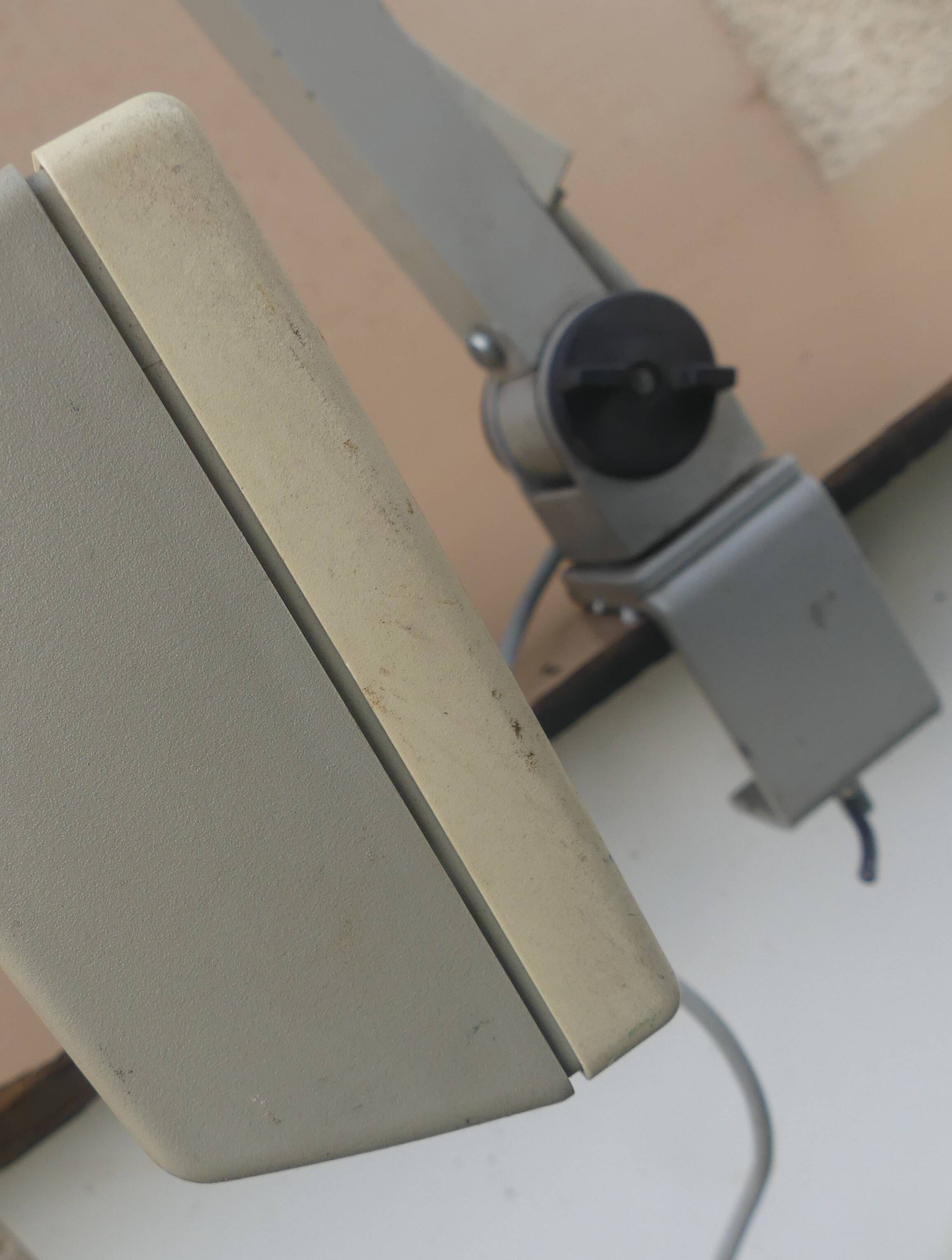 WALDMANN articulated workshop lamp with two industrial clamp arms for architects.