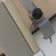 WALDMANN articulated workshop lamp with two industrial clamp arms for architects.