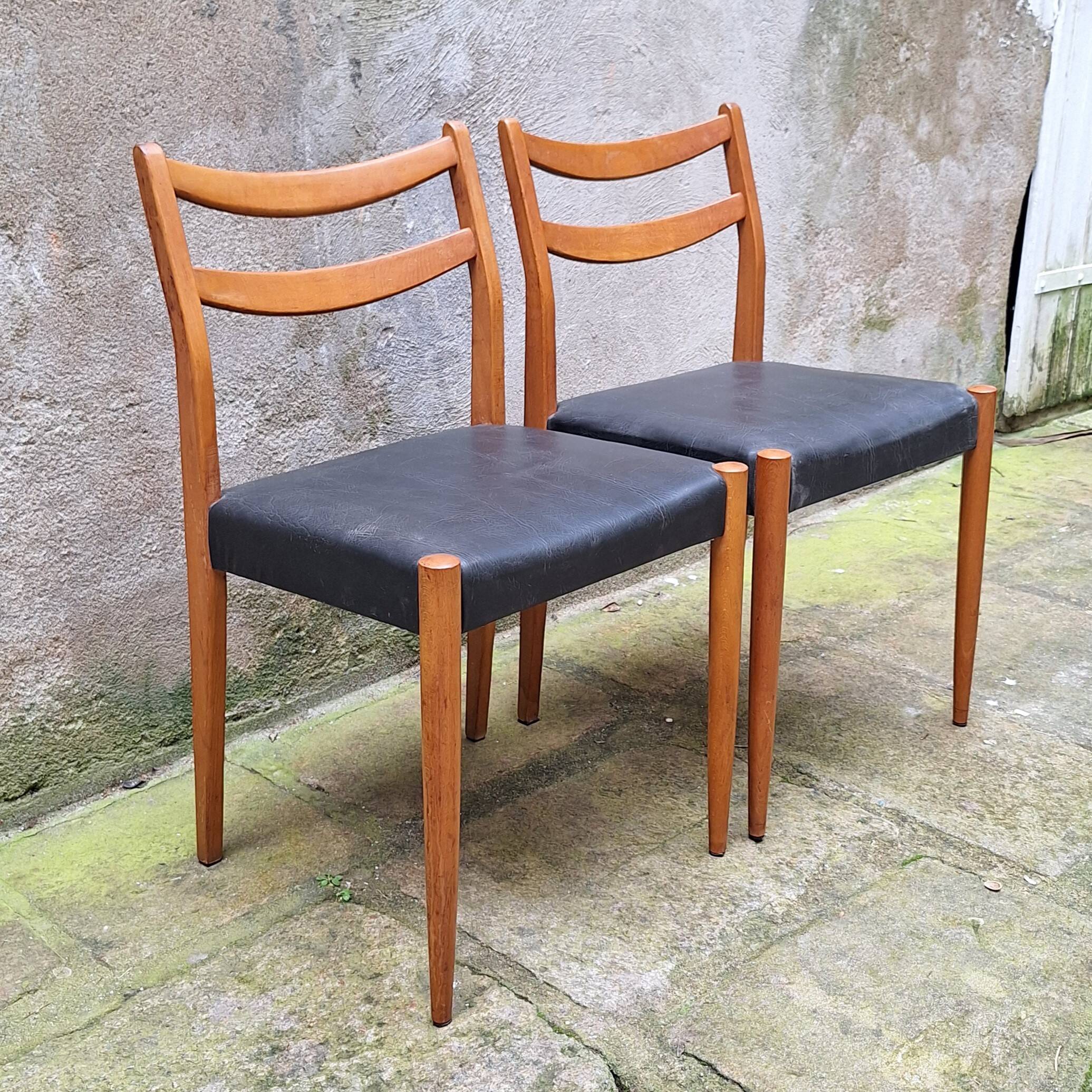 Pair of Scandinavian style chairs in wood and faux leather.