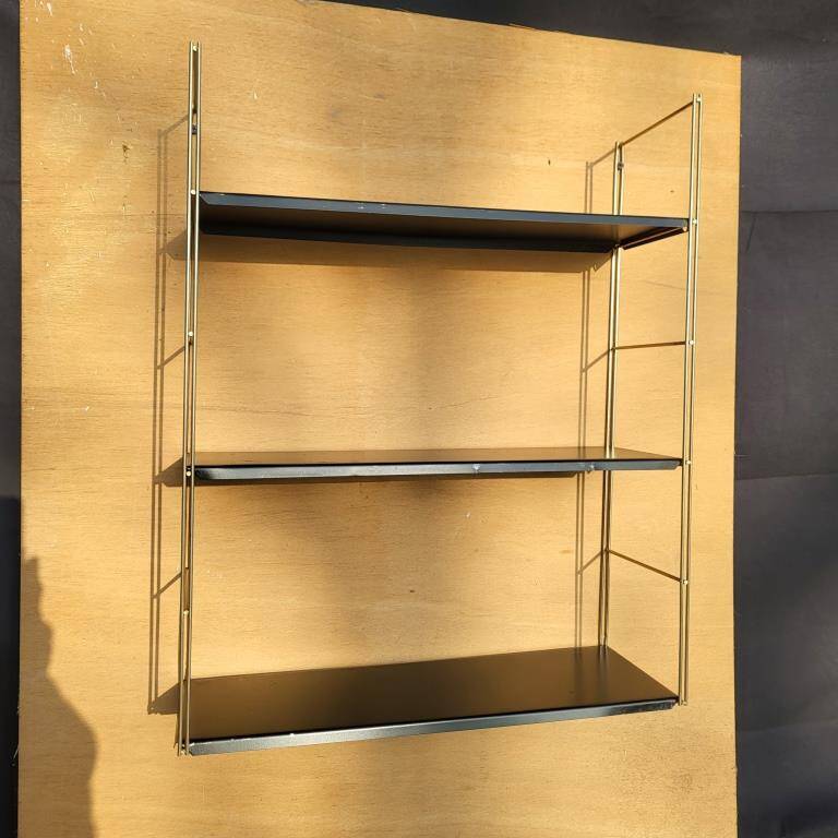 Tomado style black metal string shelf with gold ladder