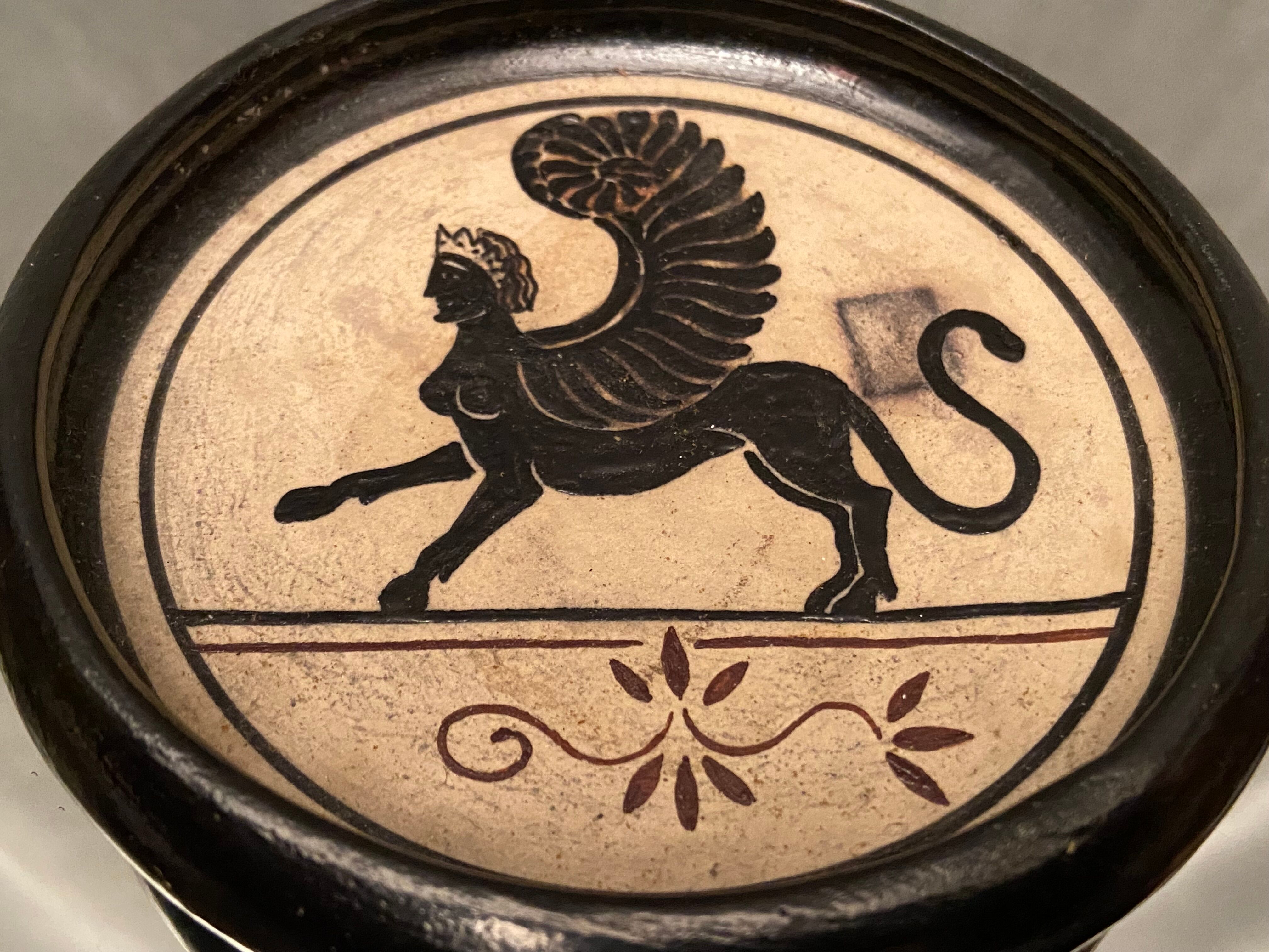 Cup decorated with winged sphinx in Ciboure sandstone signed Marie Fernandez