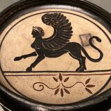 Cup decorated with winged sphinx in Ciboure sandstone signed Marie Fernandez
