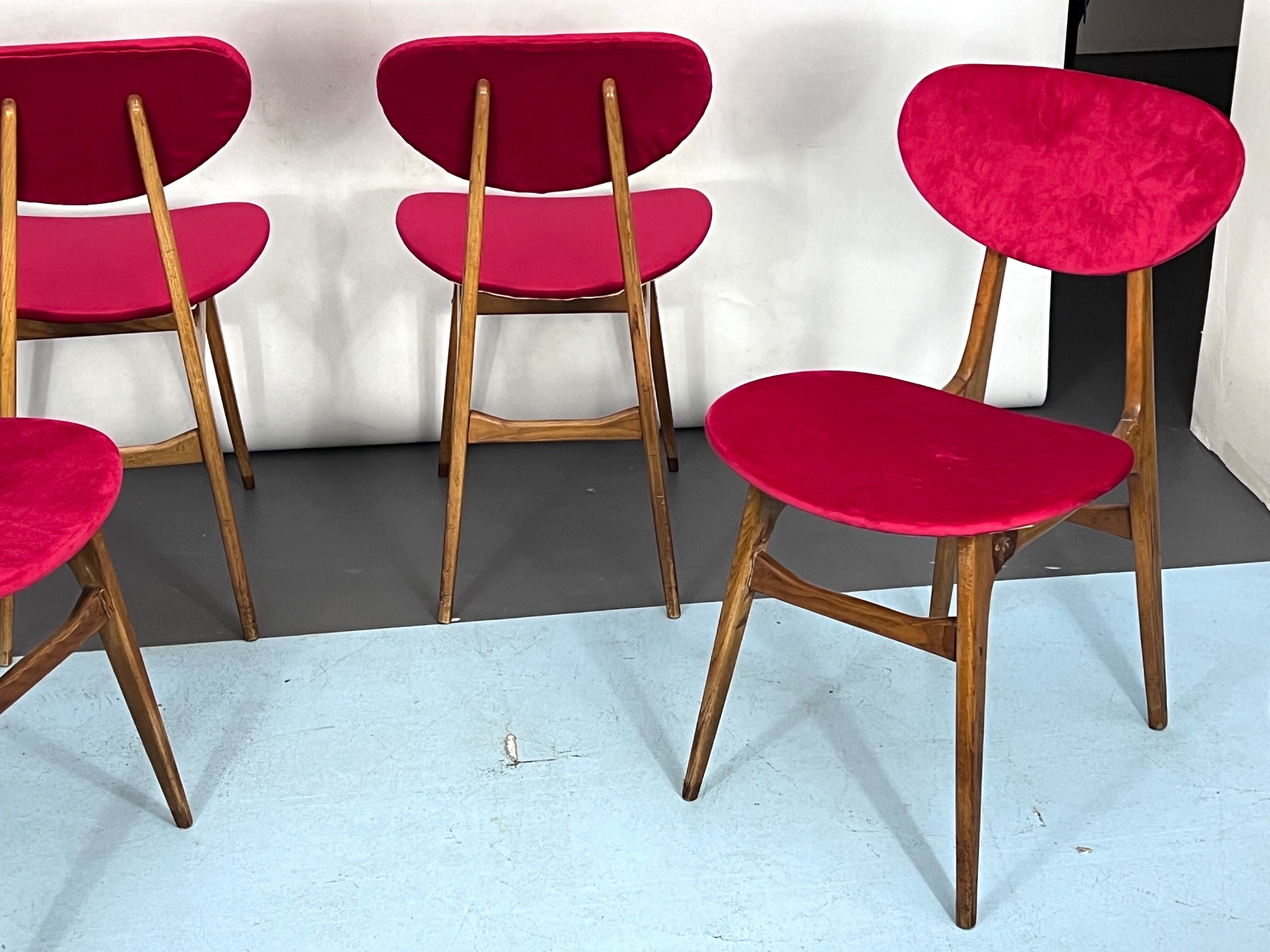 Set of four red velvet and wood dining chairs, Italy 1950