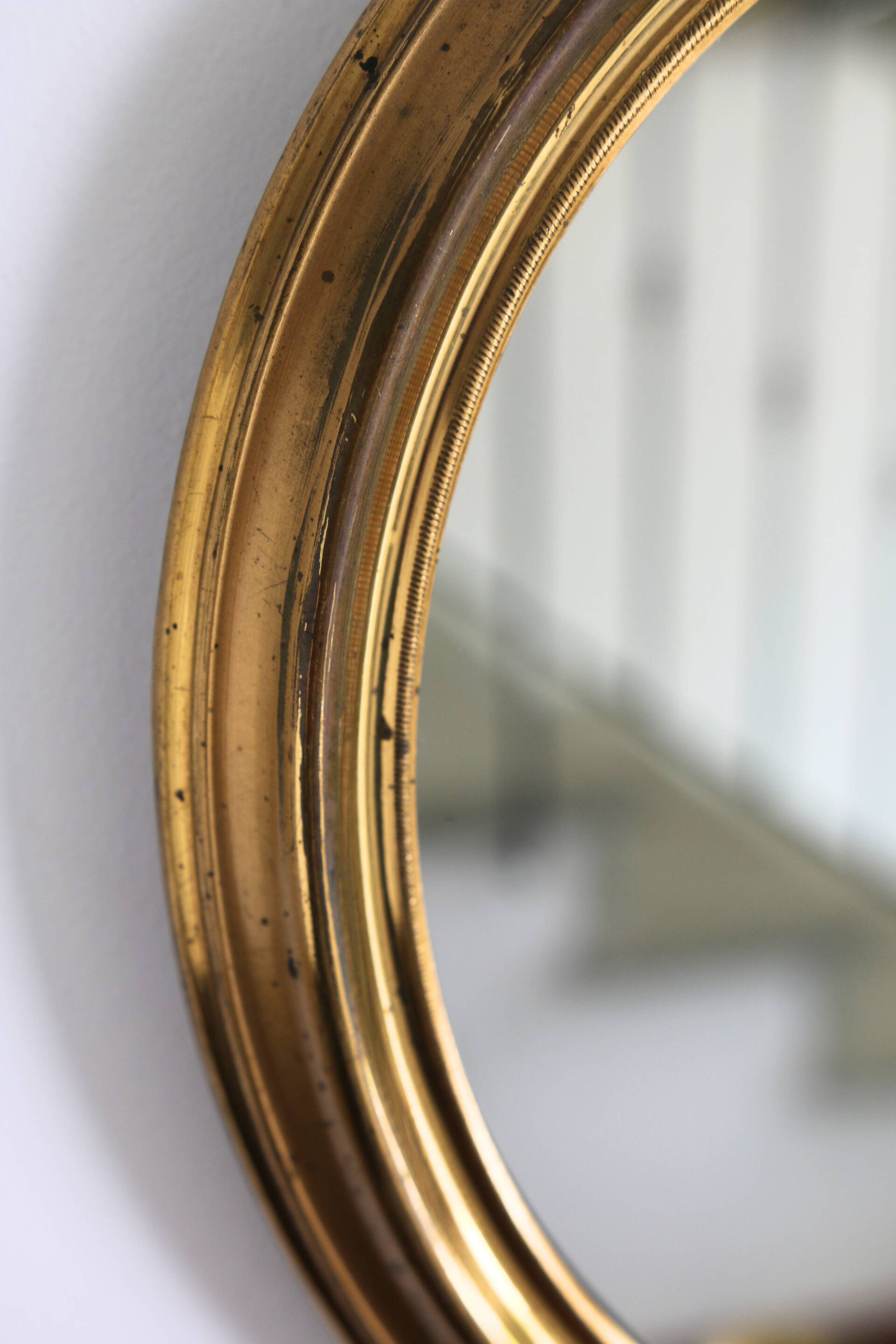 Oval brass mirror