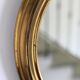 Oval brass mirror