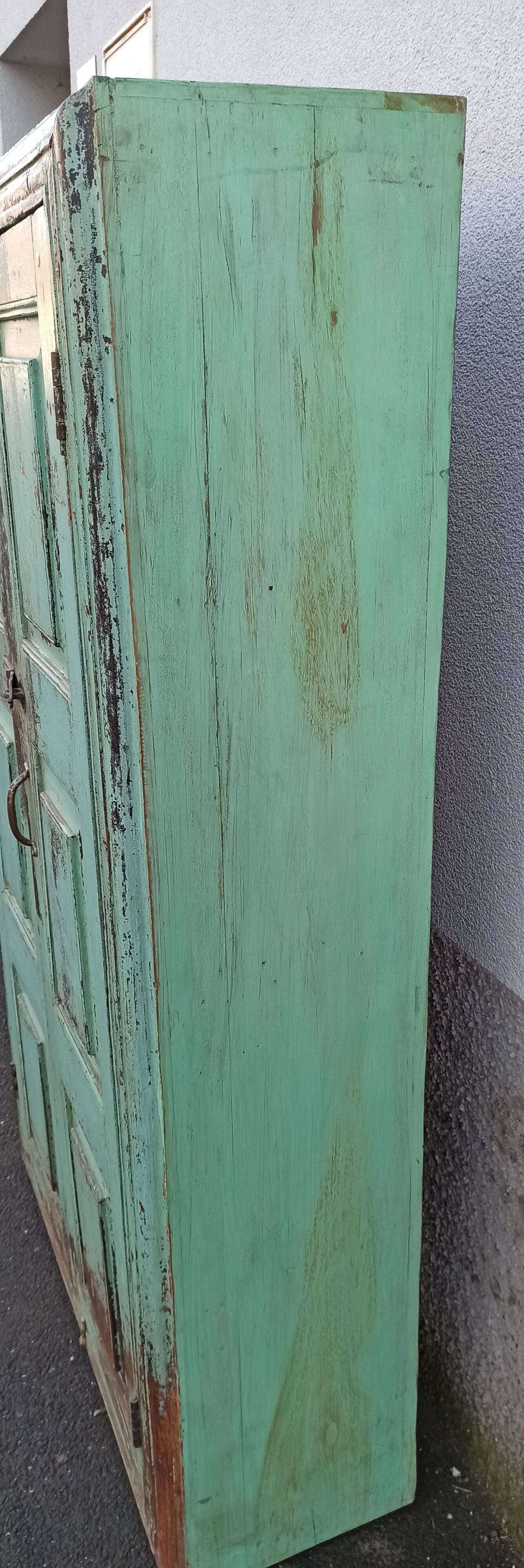 Old wooden cabinet with beautiful green patina