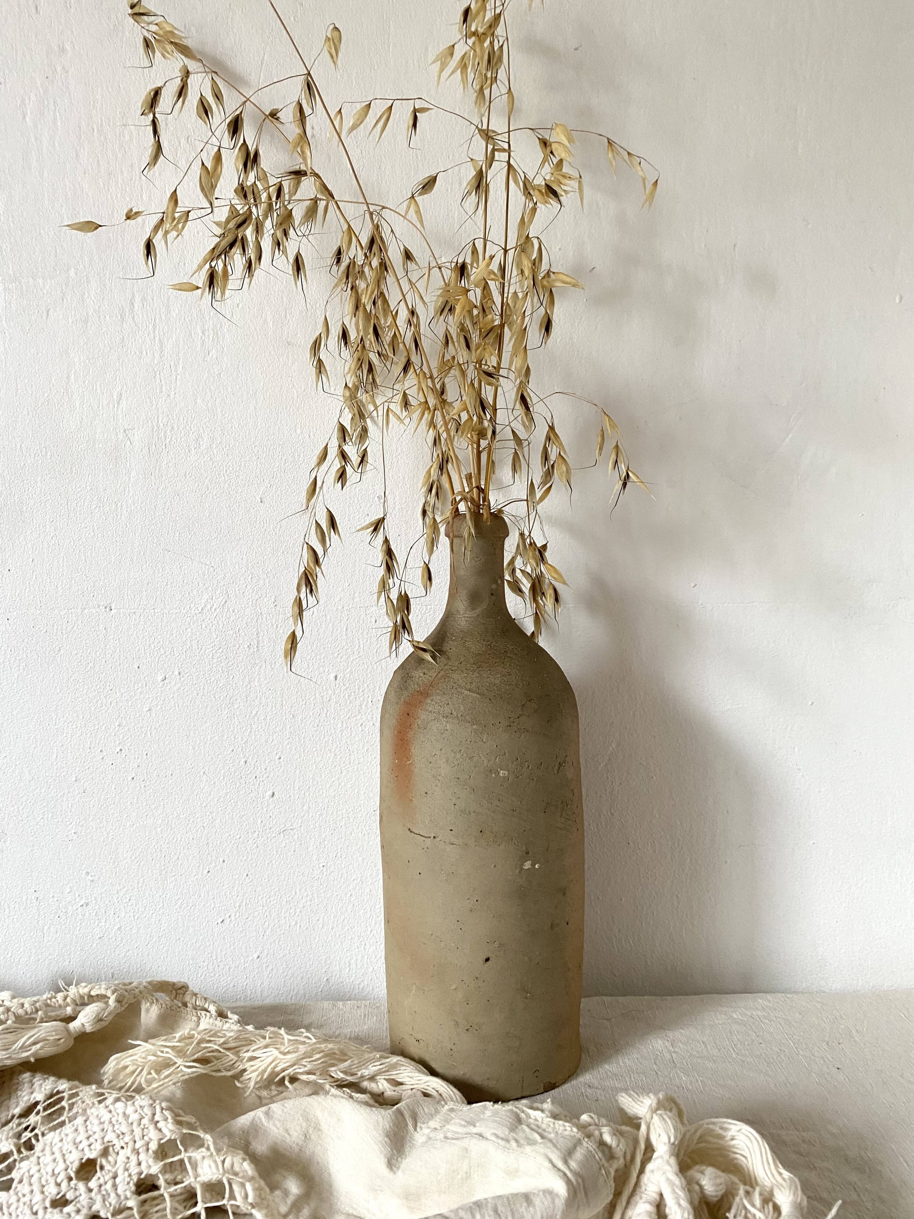 Old terracotta bottle