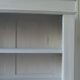 Old patinated pearl gray library, wooden top, composed of 3 adjustable shelves.