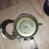 Original vintage ashtray on a small wheeled stand.