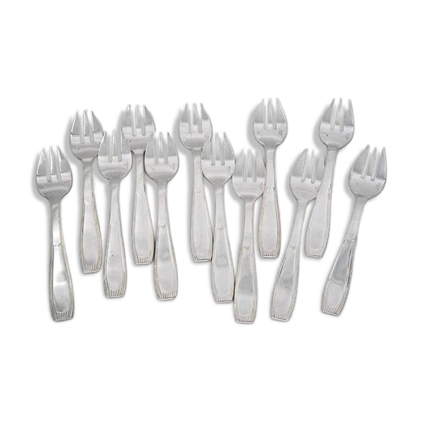 Alfénide, Christofle Paris, 12 oyster forks, Art Deco in silver-plated metal.