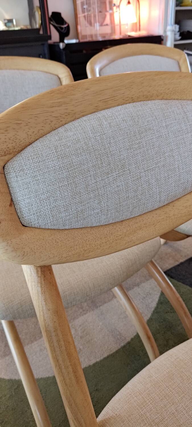 Four Scandinavian-style chairs