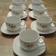 Set composé  de 7 tasses et 7 sous tasses. Porcelaine. .vintage