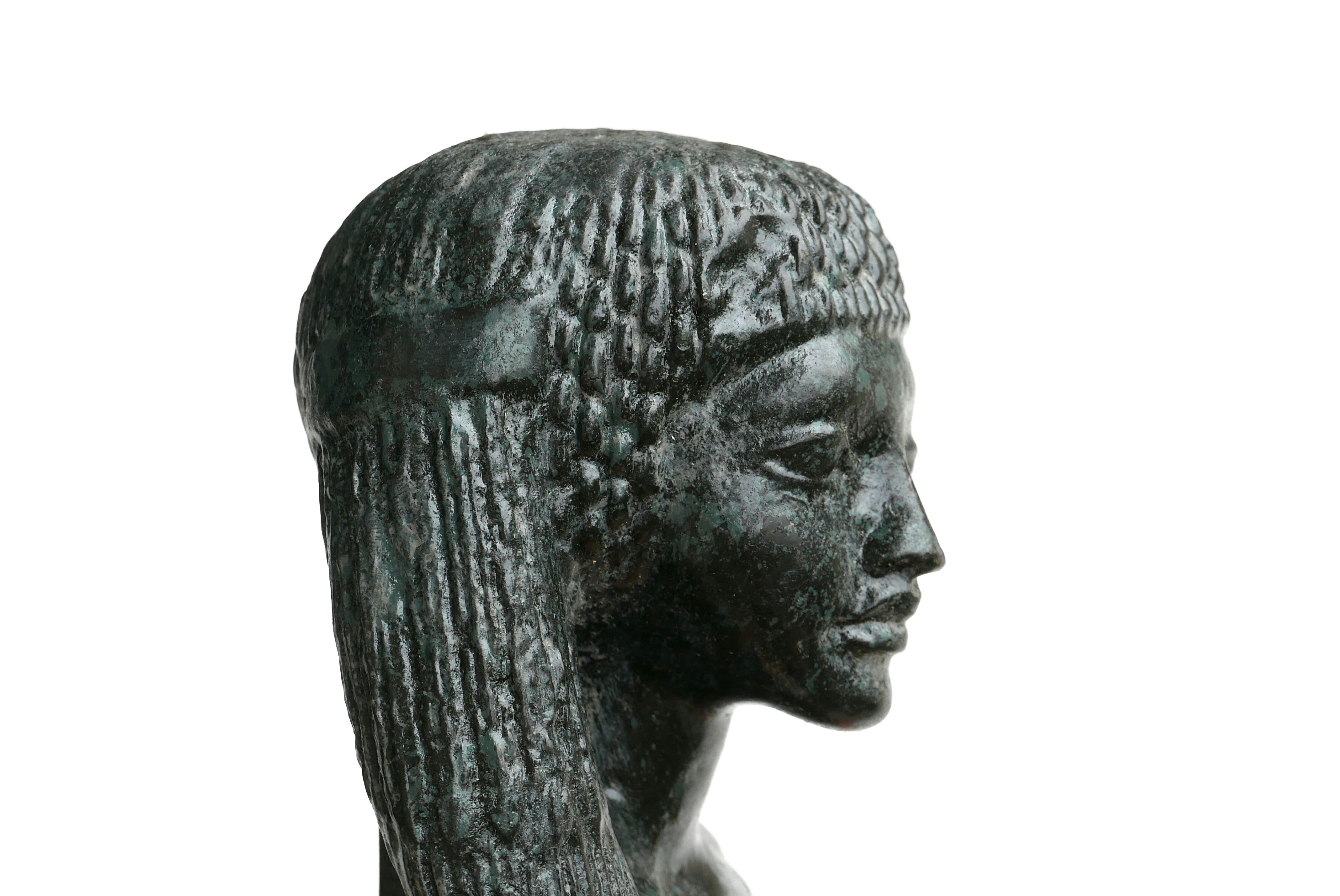 Woman bust in carved stone, 50s