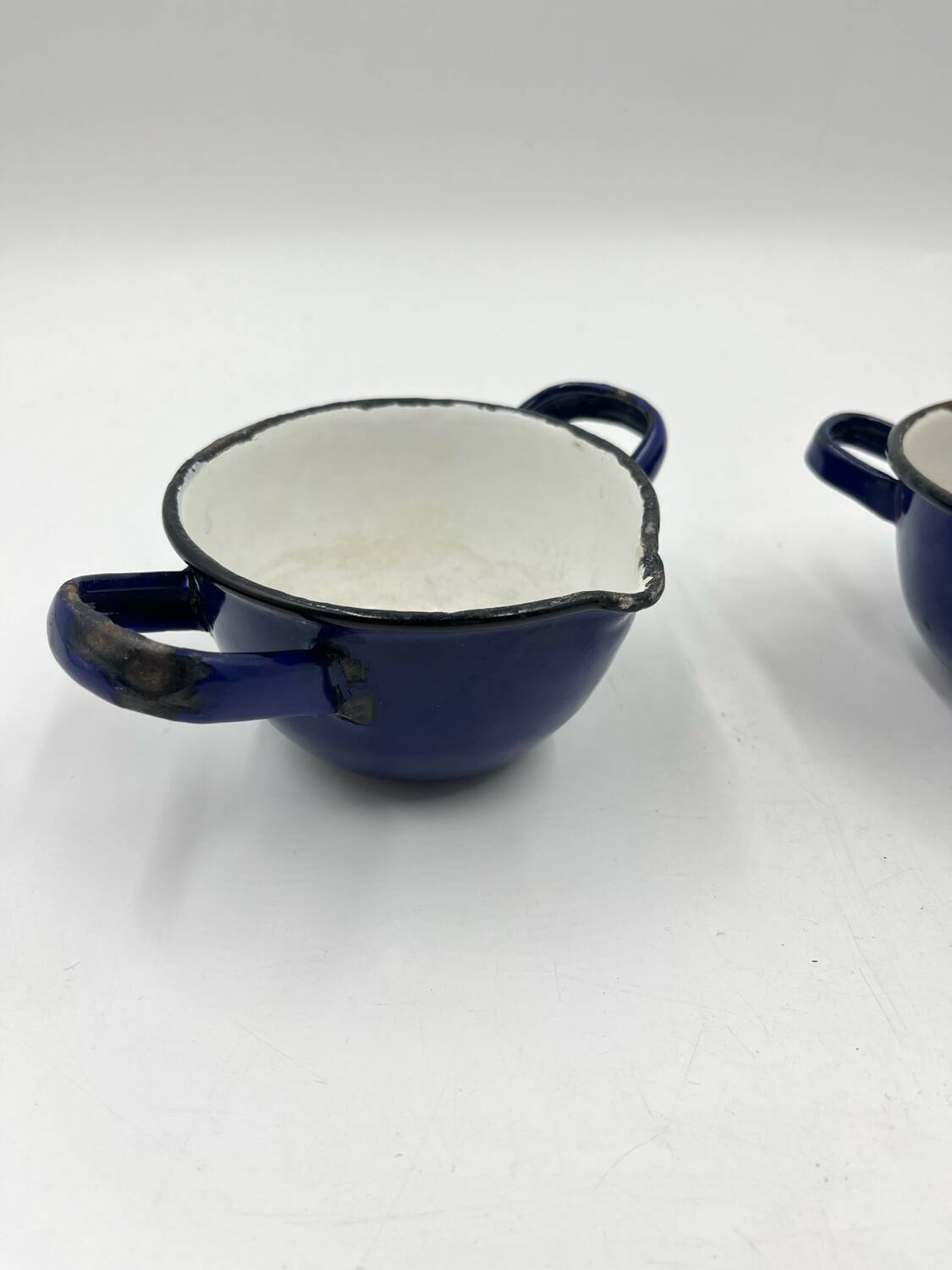 Enamelled metal fondue pot duo