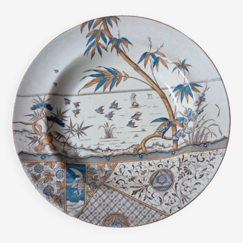 Deep dish with polychrome tropical decoration by G&W Melbourne, circa 1885
