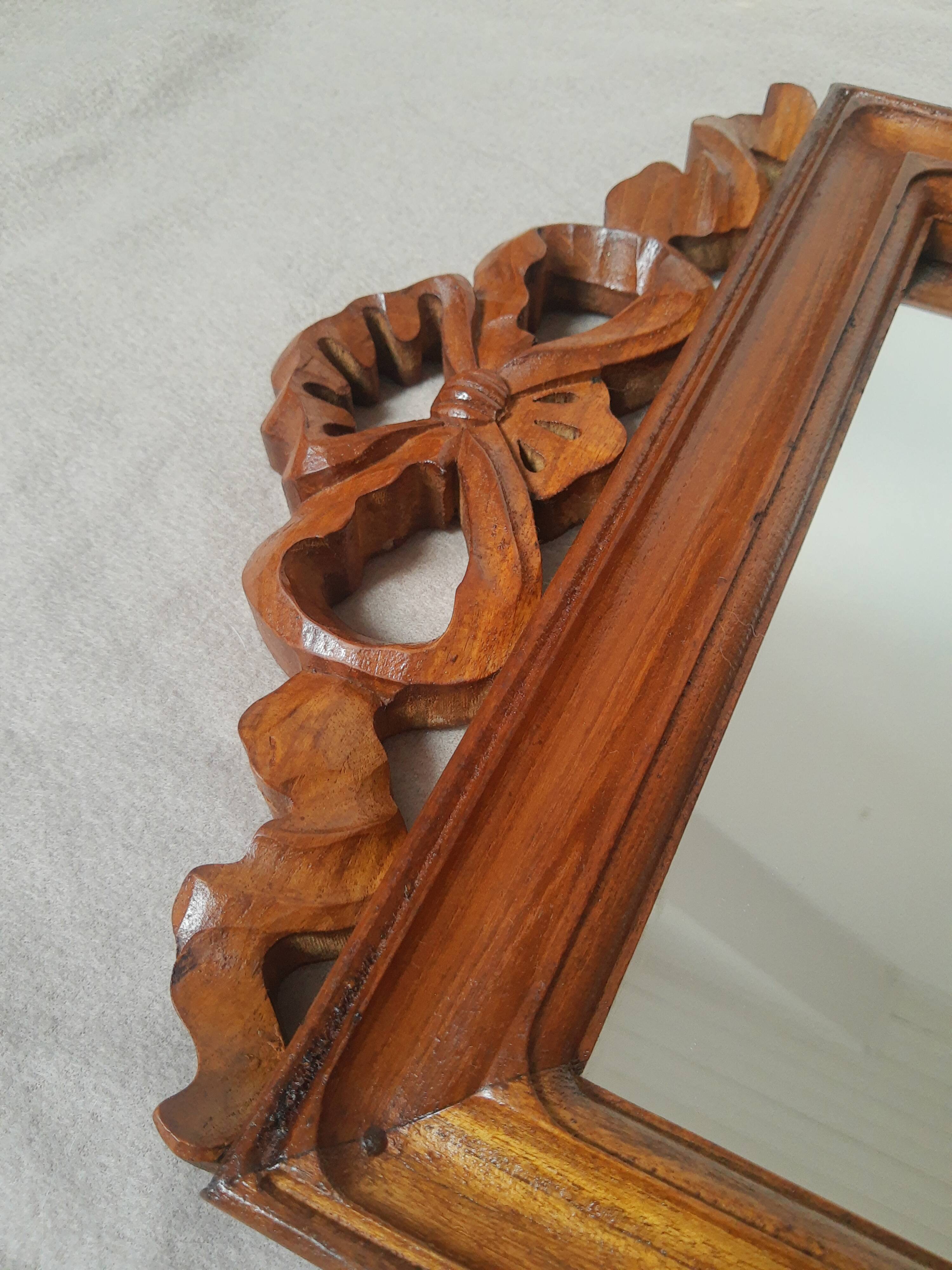 Wooden hanging mirror with vintage carved knot