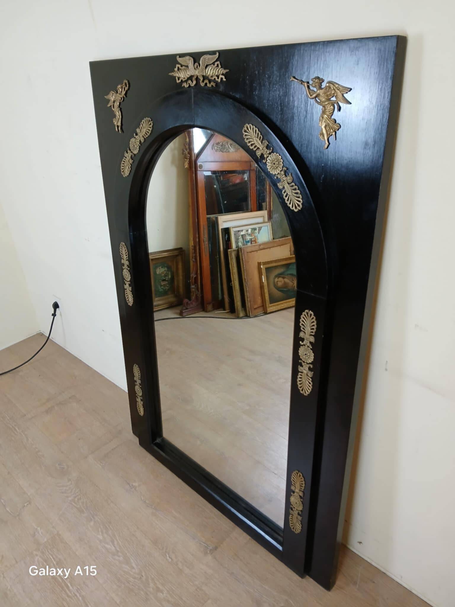 Miroir Empire en bois laqué noir et bronze doré époque XIXeme