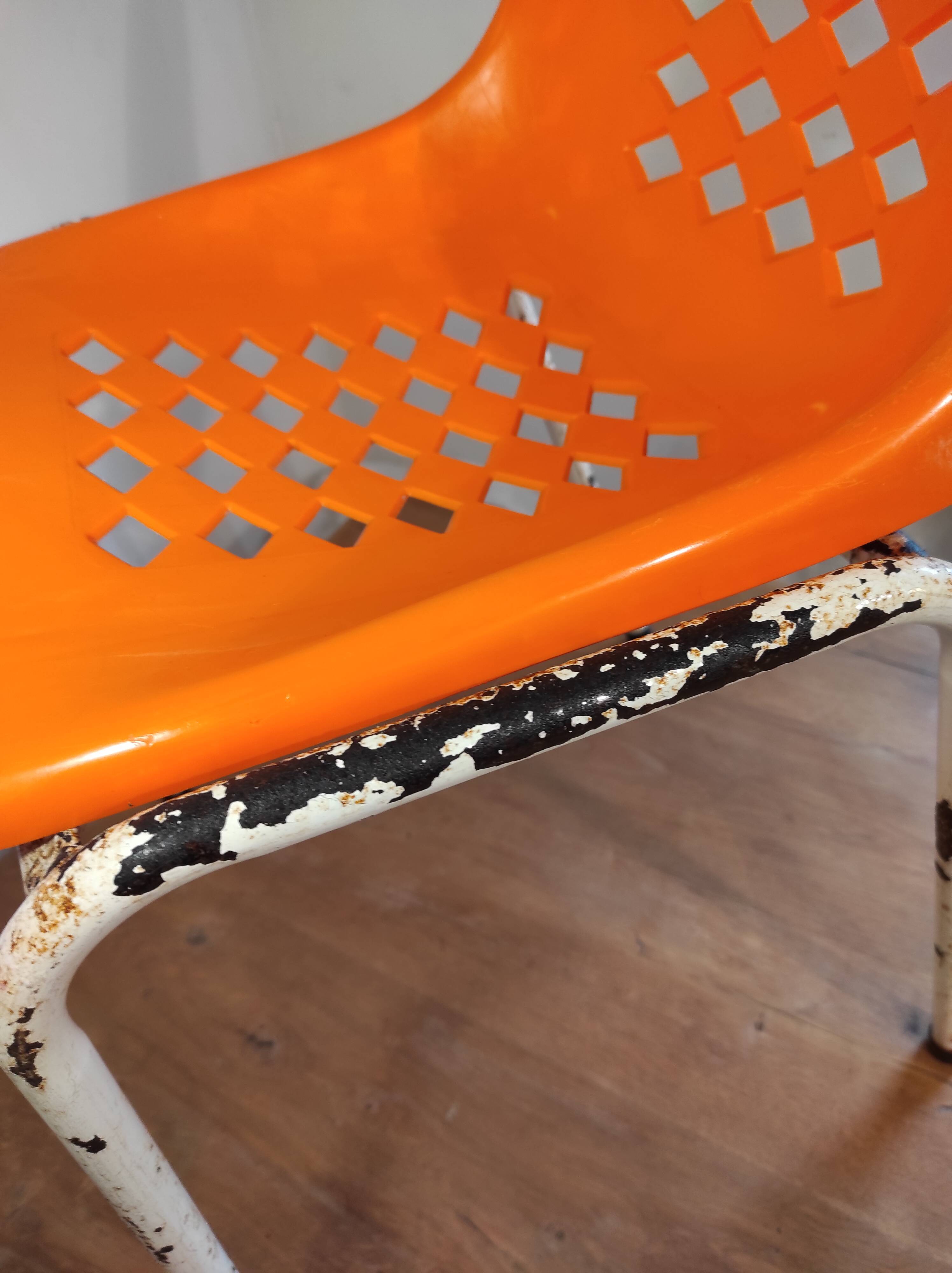 Chair with openwork plastic shell 1970