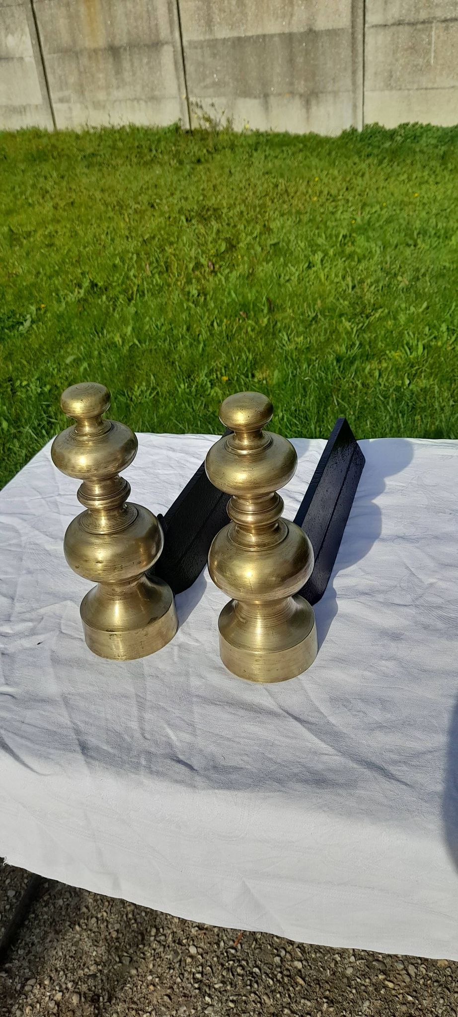 Pair of andirons in black metal and golden balls