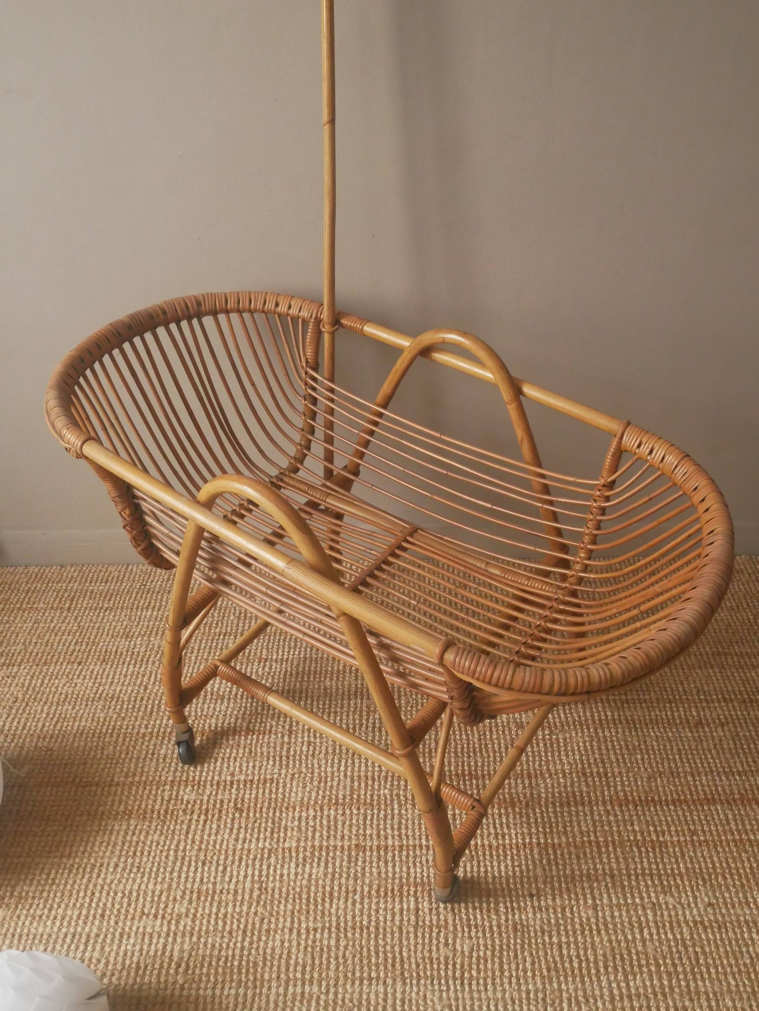 Vintage rattan cradle bassinet on wheels retro Scandinavian design baby bed