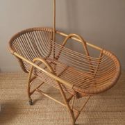 Vintage rattan cradle bassinet on wheels retro Scandinavian design baby bed