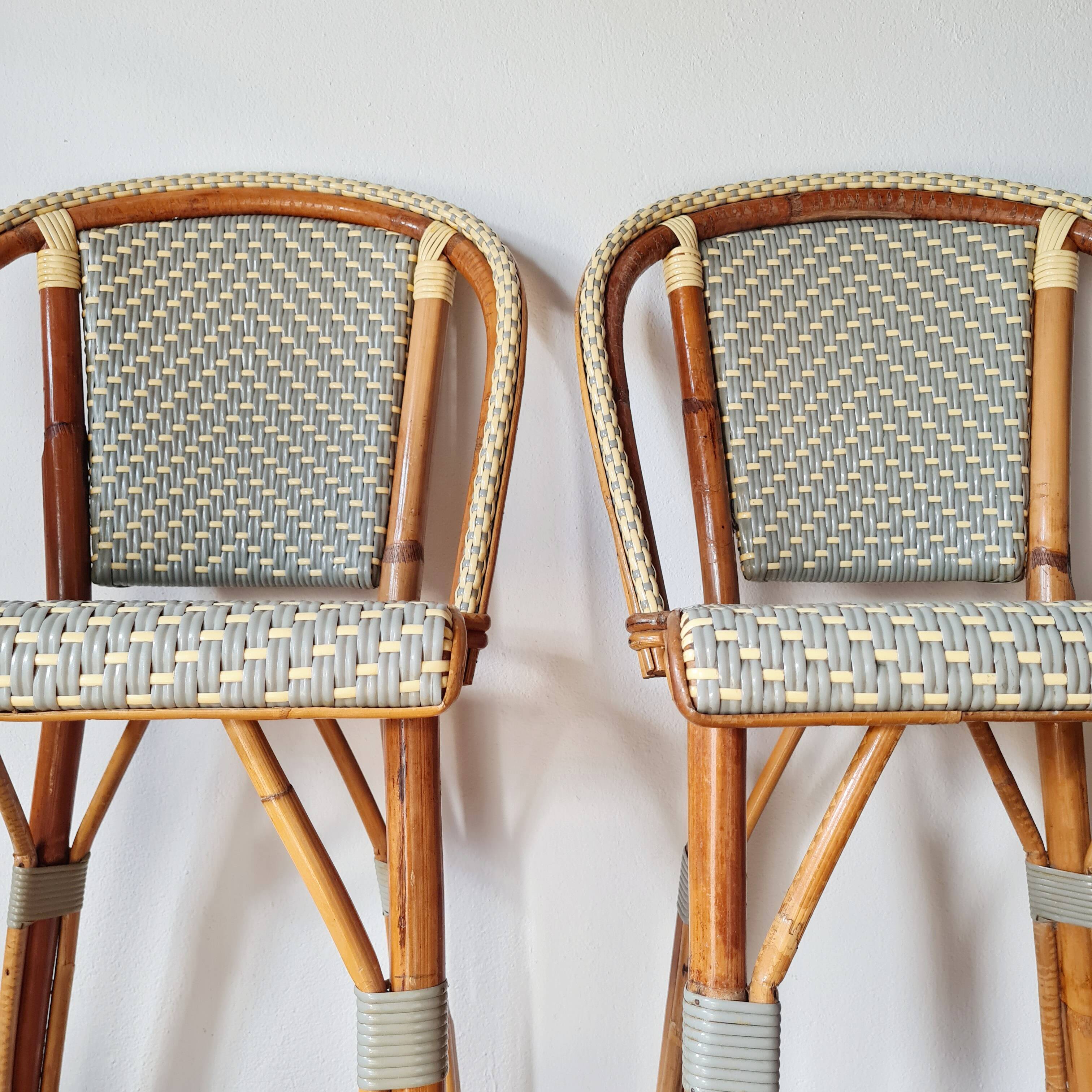Pair of vintage Gatti bar stools in two-tone rattan and caning.