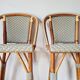 Pair of vintage Gatti bar stools in two-tone rattan and caning.