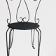 Pair of wrought iron garden chairs