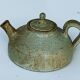 Vintage teapot in reeds