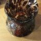Plum-colored bubbled blown glass vase