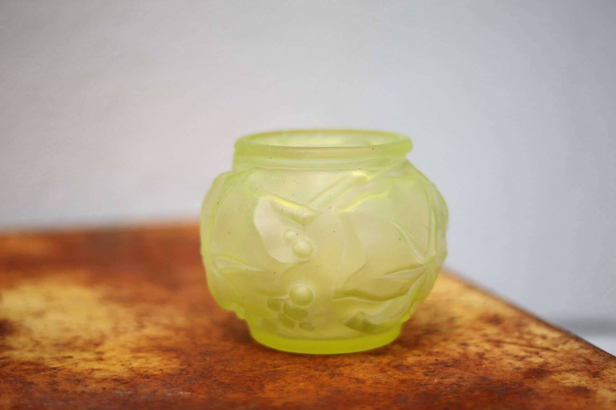 Fluorescent yellow ball vase with vine leaf patterns