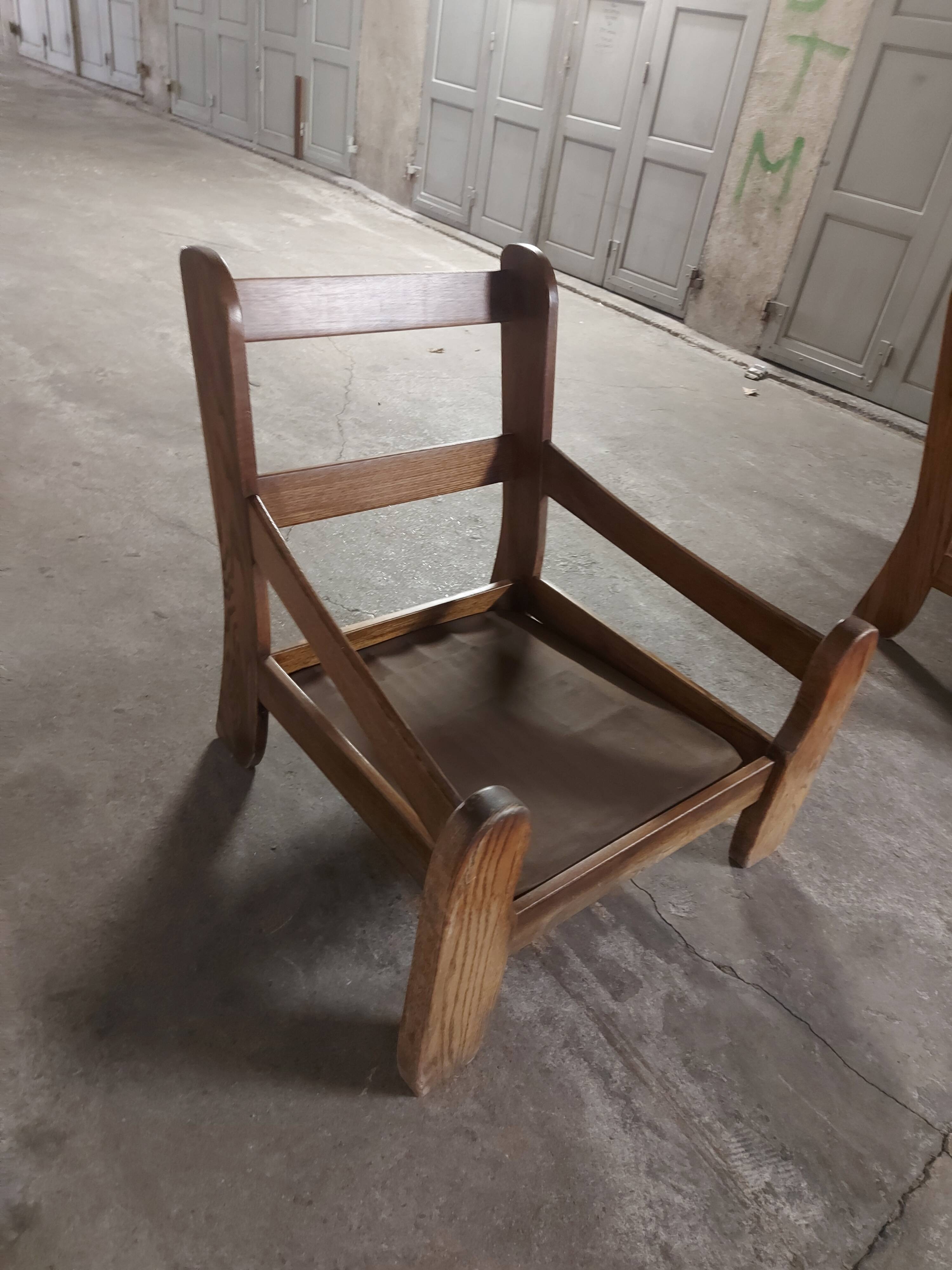 Armchairs in leather and vintage wood 70's