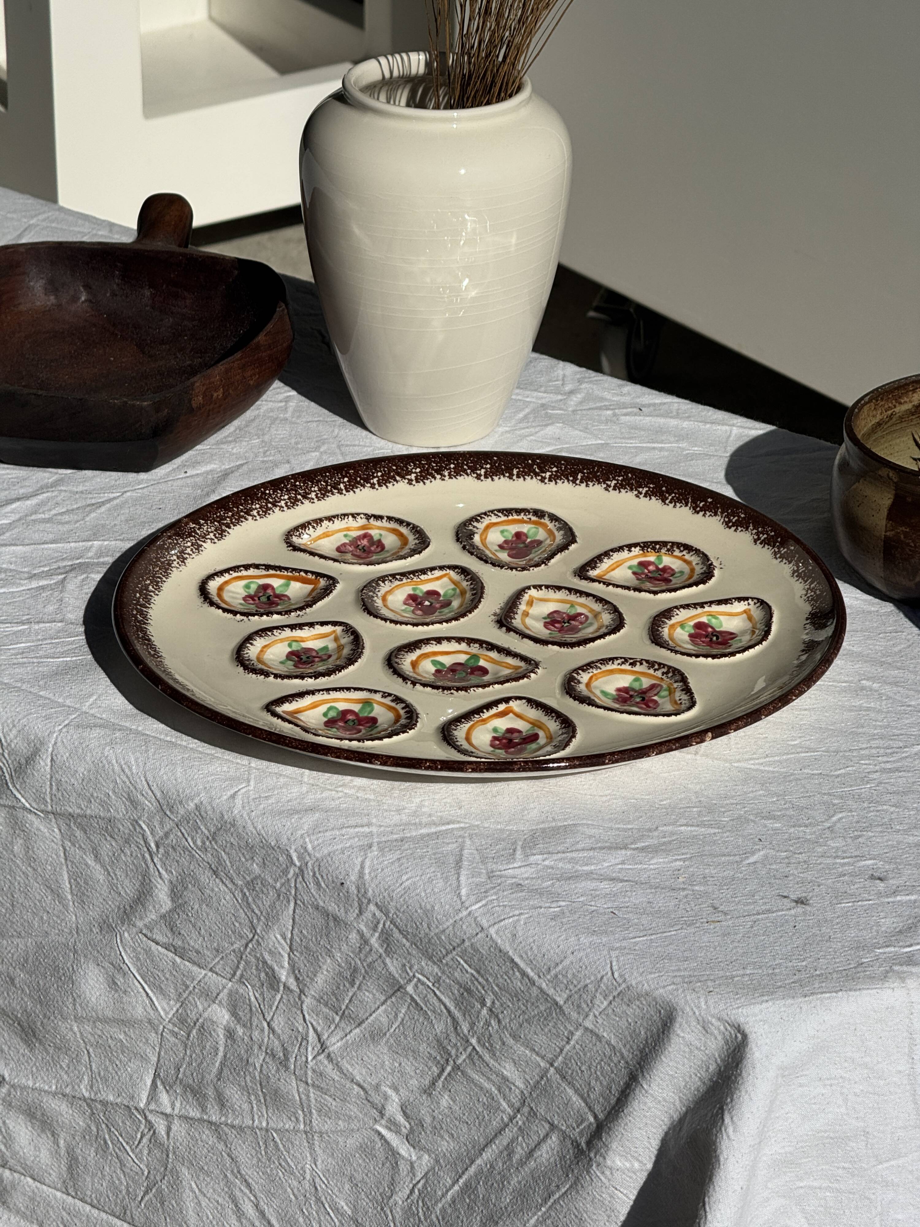 Large circular platter with compartments for shellfish, molluscs, and oysters.