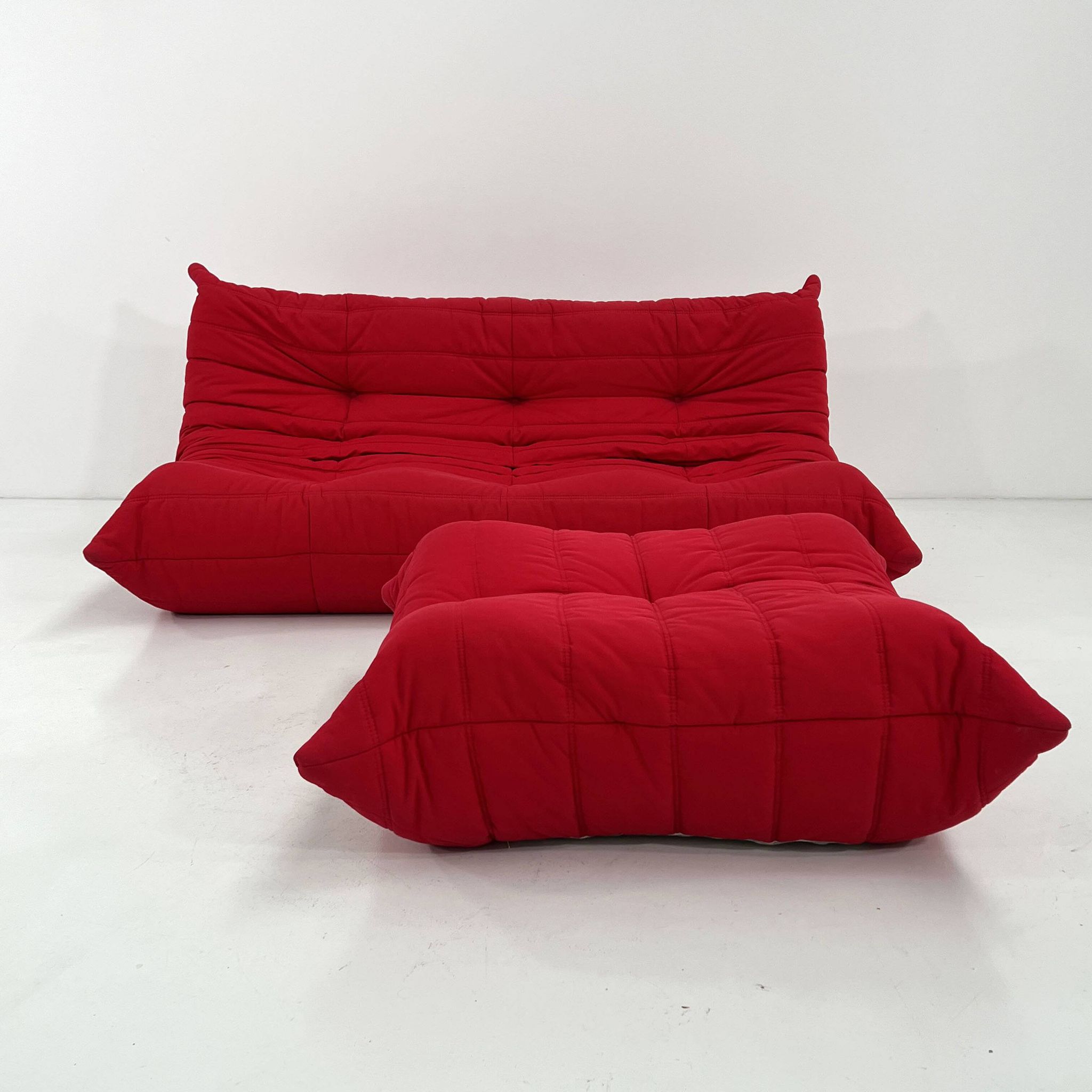 Togo 3-seater with red ottoman by Michel Ducaroy for Ligne Roset, 1970.