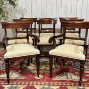 Set of 2 armchairs and 6 English mahogany chairs from the 1950s.