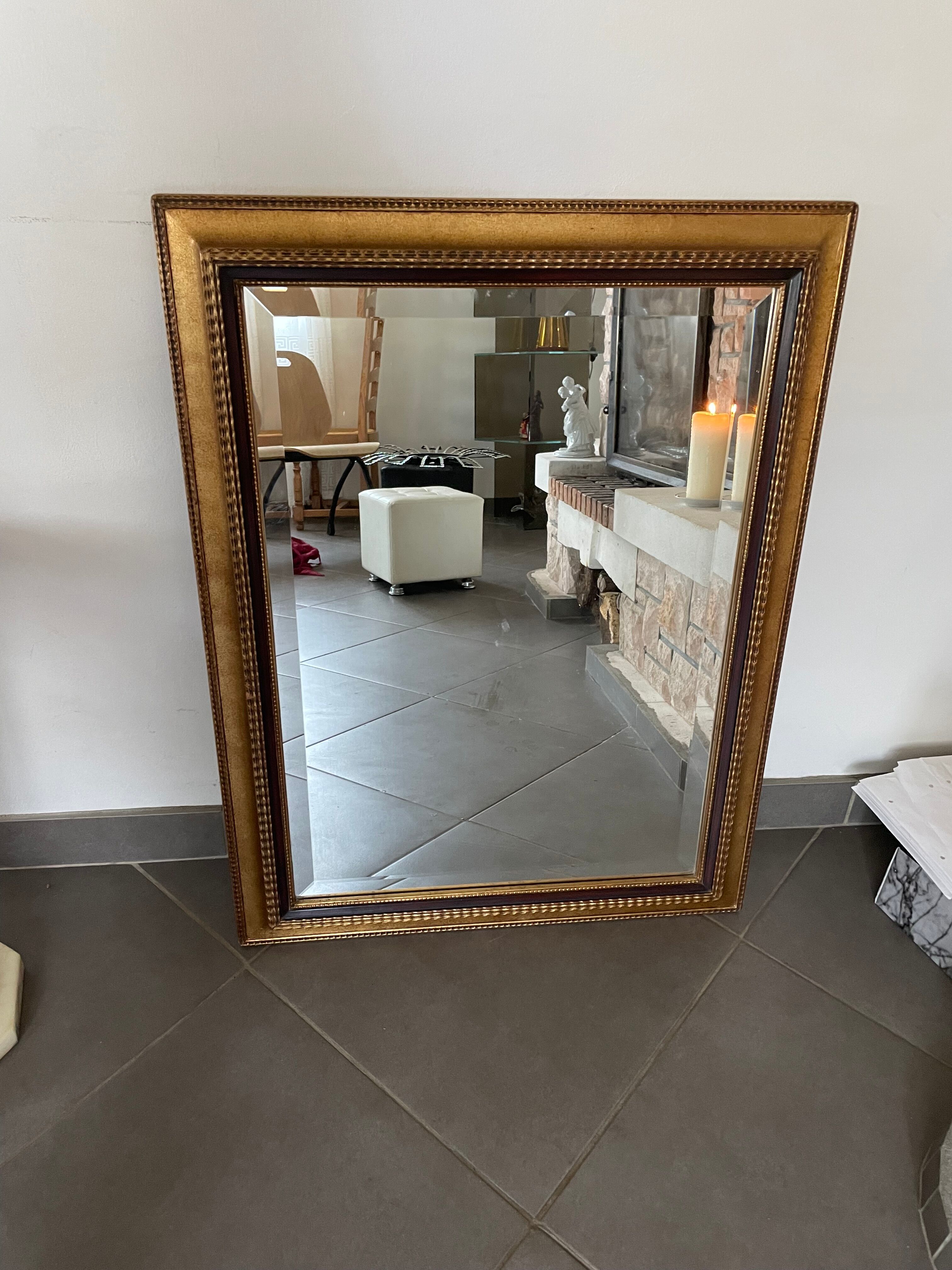 Mirror gilded frame black net and beveled ice used