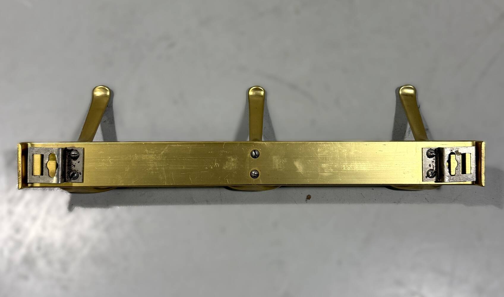Gold coloured aluminium wall coat racks 1960’s