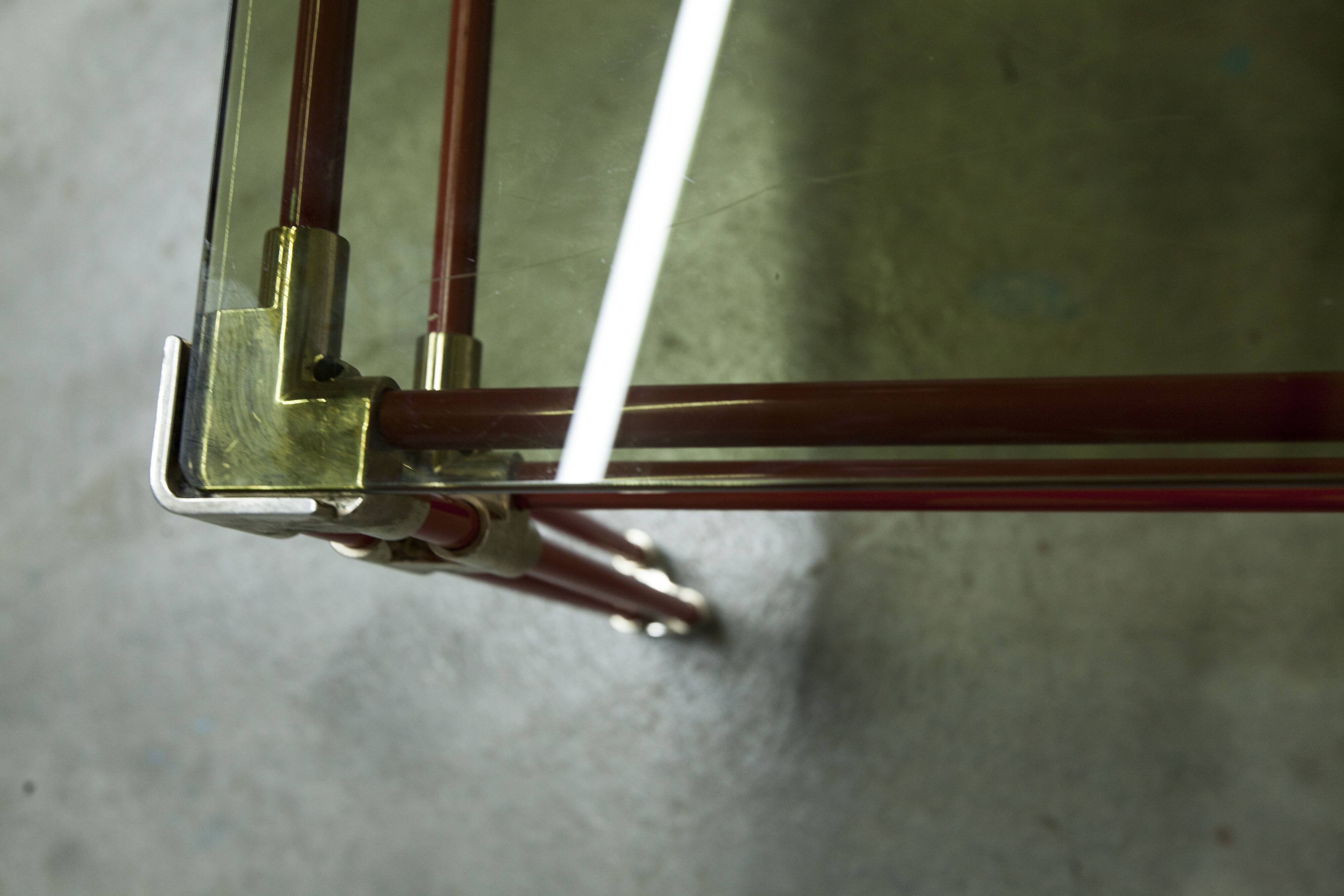 Postmodern Italian design coffee table in smoked glass with red steel structure