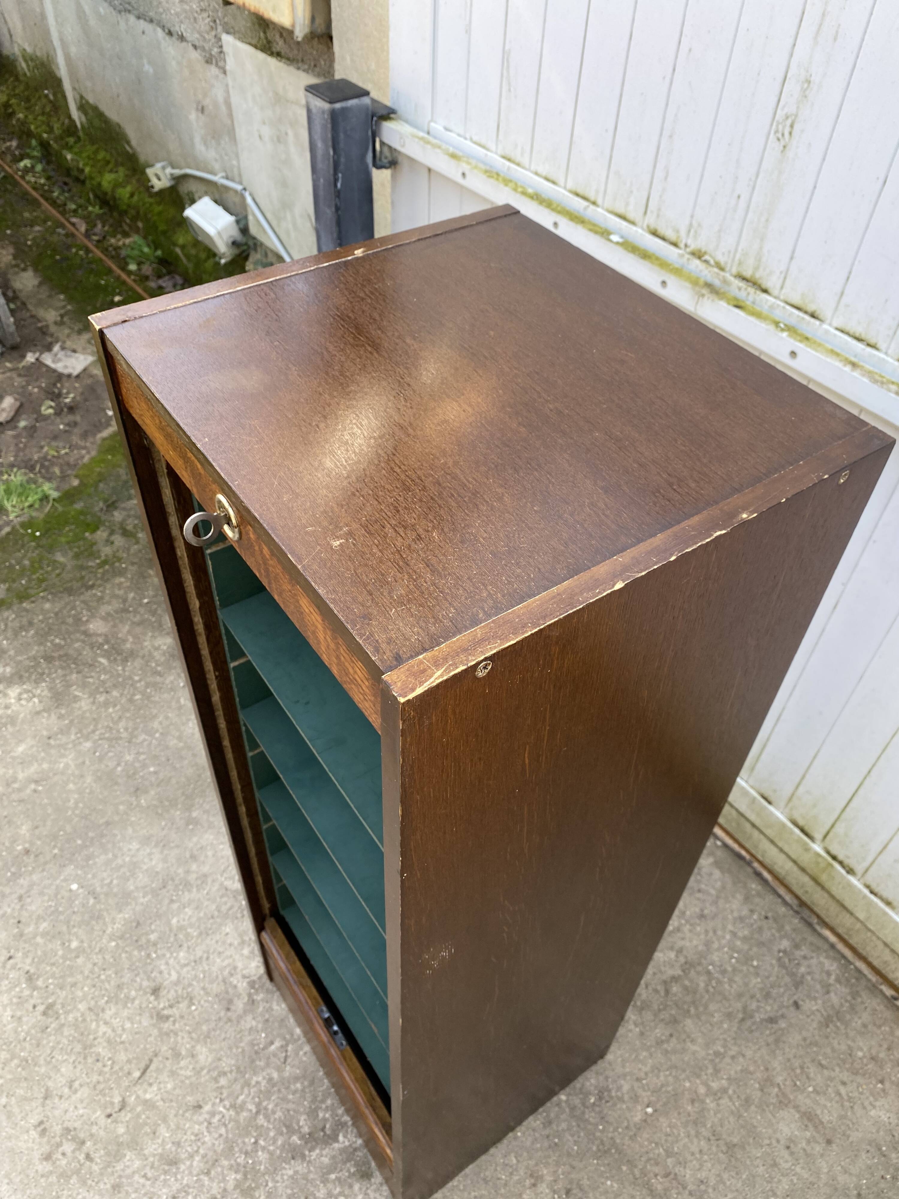 1970 oak office storage cabinet with curtains.