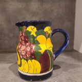 Ceramic pitcher with fruit and vine decoration - colorful rustic style