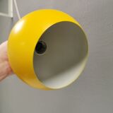 Spherical pendant lamp in sunny yellow.